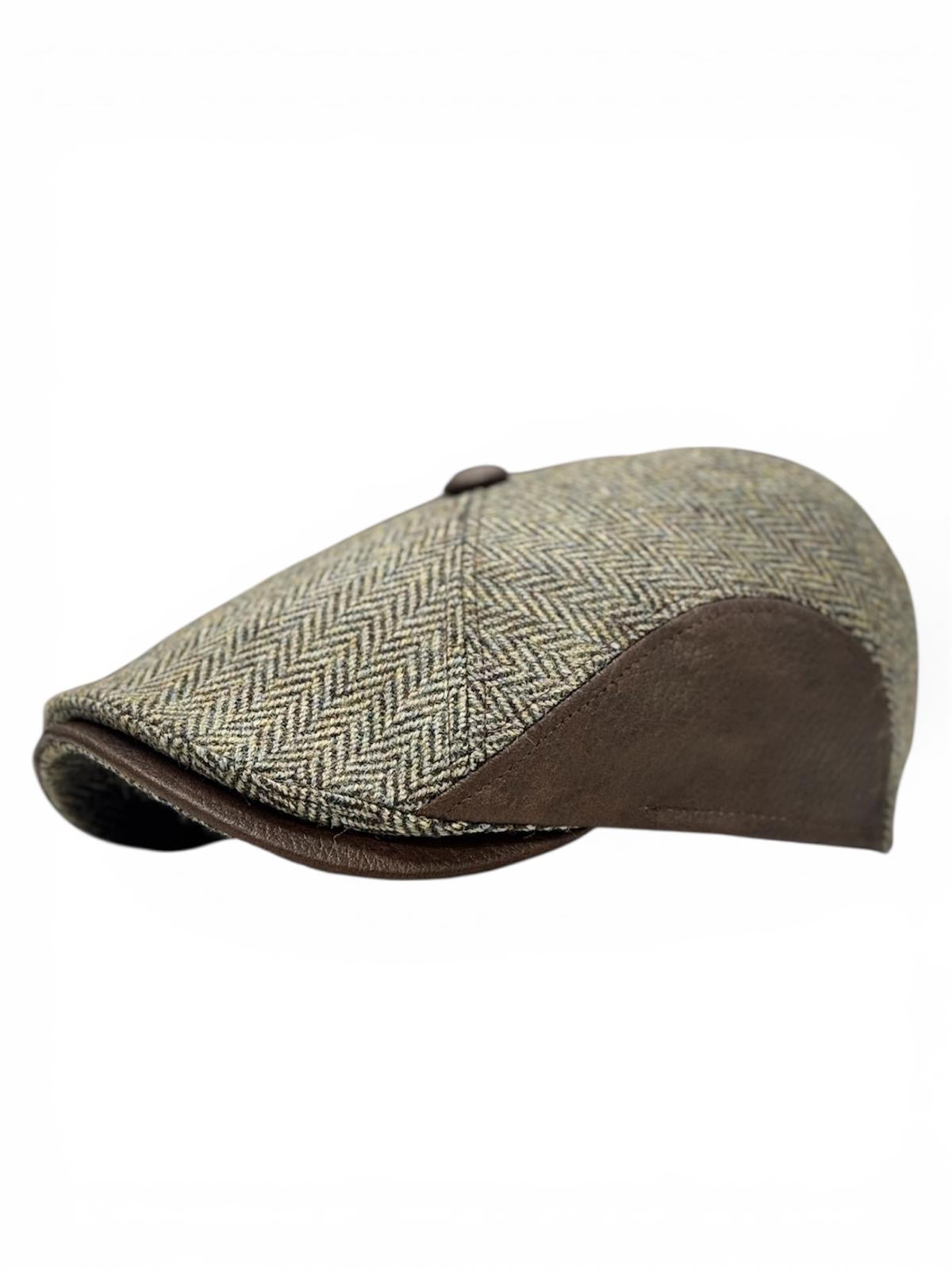 Modello Manchester in tessuto lana shetland spinato in beige mélange abbinata alla vera pelle marrone, un modello dai tagli unici nel suo genere